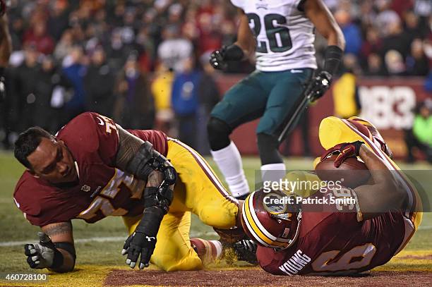 Darrel Young of the Washington Redskins falls over Shawn Lauvao to score a touchdown in the third quarter against the Philadelphia Eagles at...