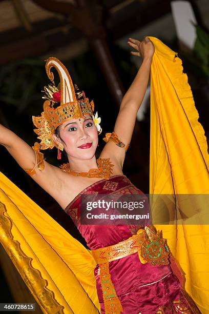 female balinese dancer is performing a traditonal dance - bali dancing stock pictures, royalty-free photos & images