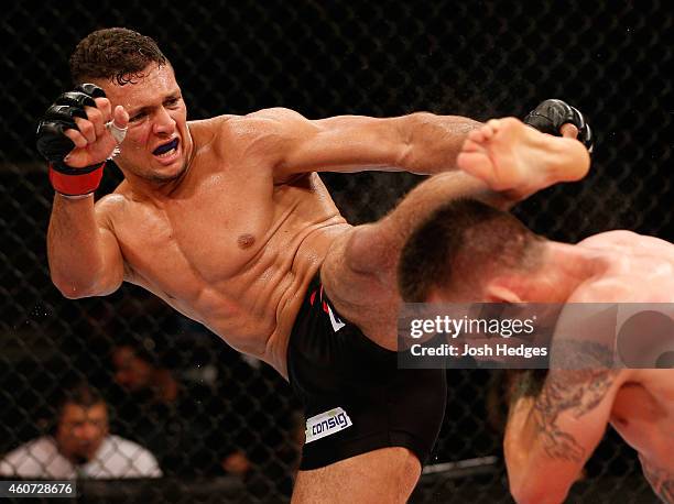 Marcio Alexandre of Brazil kicks Tim Means of the United States in their welterweight fight during the UFC Fight Night event inside the Ginasio Jose...