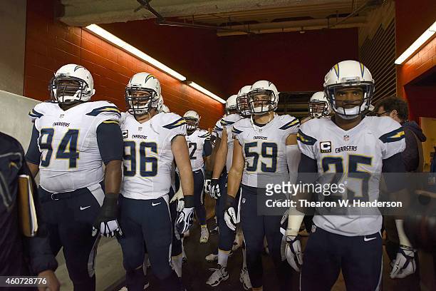 Corey Liuget, Jarret Johnson, Andrew Gachkar and Darrell Stuckey of the San Diego Chargers prepare to take the field against the San Francisco 49ers...