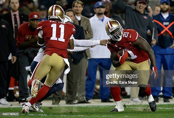 Running back Frank Gore of the San Francisco 49ers breaks a tackle by free safety Eric Weddle of the San Diego Chargers as he scores on a 52-yard...