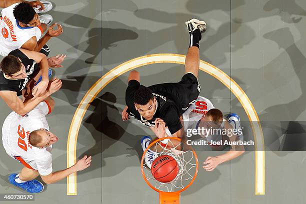 Alex Murphy of the Florida Gators looks up as Devin Thomas of the Wake Forest Demon Deacons scores a basket during the MetroPCS Orange Bowl...