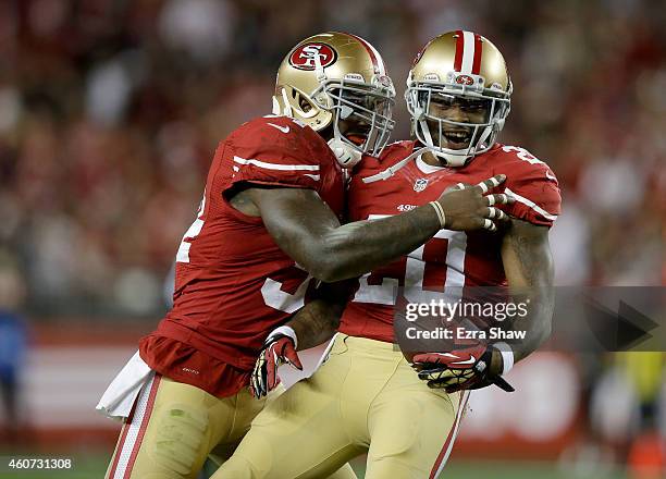 Perrish Cox of the San Francisco 49ers celebrates with Nick Moody after Cox intercepts a pass in the first quarter against the San Diego Chargers at...