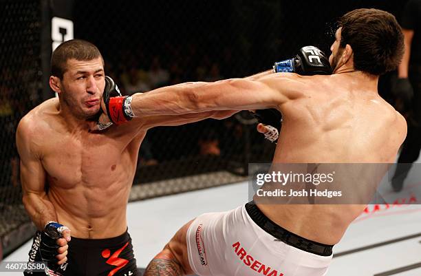 Rashid Magomedov of Russia punches Elias Silverio of Brazil in their lightweight fight during the UFC Fight Night event inside the Ginasio Jose...