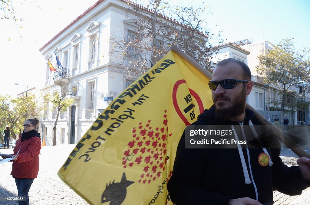 A demonstrator holds a flag of the 'I Dont Pay' movement in...