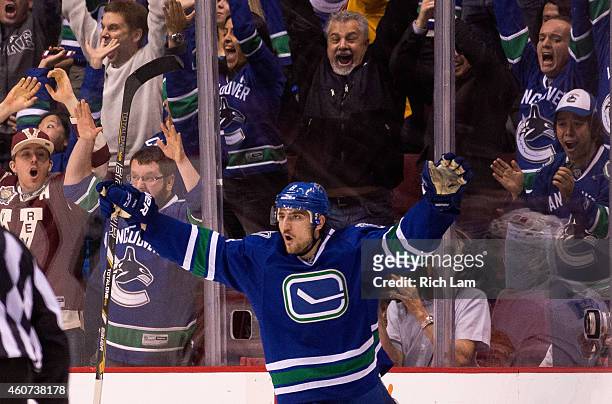 Christopher Tanev of the Vancouver Canucks celebrates after scoring the game winning goal against the Calgary Flames in overtime in NHL action in...