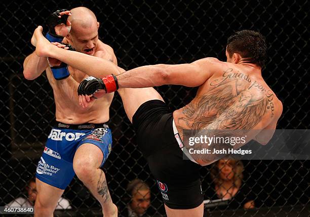 Renan Barao of Brazil kicks Mitch Gagnon of Canada in their bantamweight fight during the UFC Fight Night event inside the Ginasio Jose Correa on...