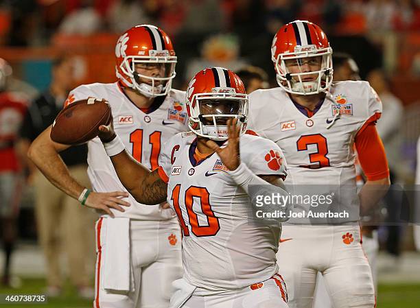 Chad Kelly Nick Schuessler look on as Tajh Boyd of the Clemson Tigers throws the ball prior to the game against the Ohio State Buckeyes during the...