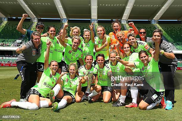 Canberra players and coaching support staff celebrate winning the W-League Grand Final match between Perth and Canberra at nib Stadium on December...