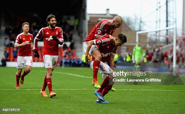 Jamie Paterson of Nottingham Forest celebrates scoring his third goal with Henri Lansbury goal during the Budweiser FA Cup Third Round match between...