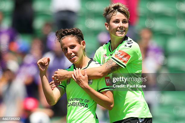 Ashleigh Sykes and Michelle Heyman of Canberra celebrate a goal during the W-League Grand Final match between Perth and Canberra at nib Stadium on...