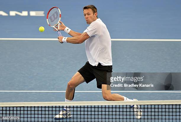 Daniel Nestor of Canada plays a forehand volley in the Mens Doubles Final partnered with Mariusz Fyrstenberg in their match against Robert Farah of...