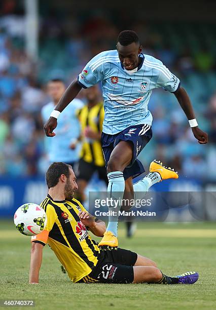 Bernie Ibini-Isei of Sydney jumps over Andrew Durante of Wellington during the round 12 A-League match between Sydney FC and Wellington Phoenix at...