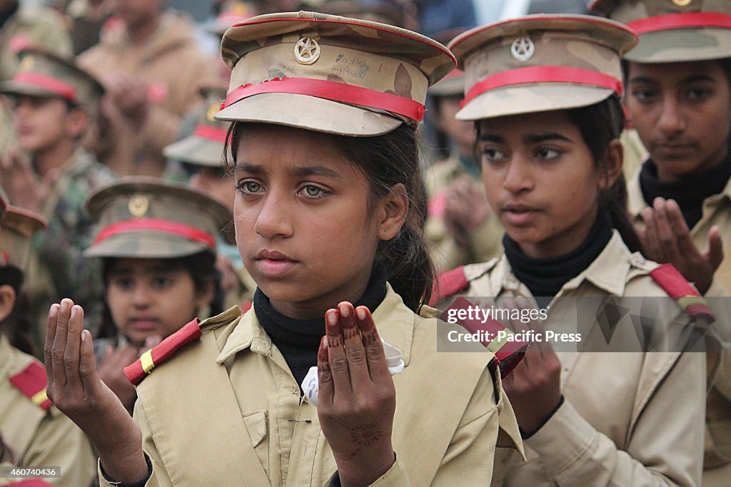 Pakistani students in army uniform attend the protest...