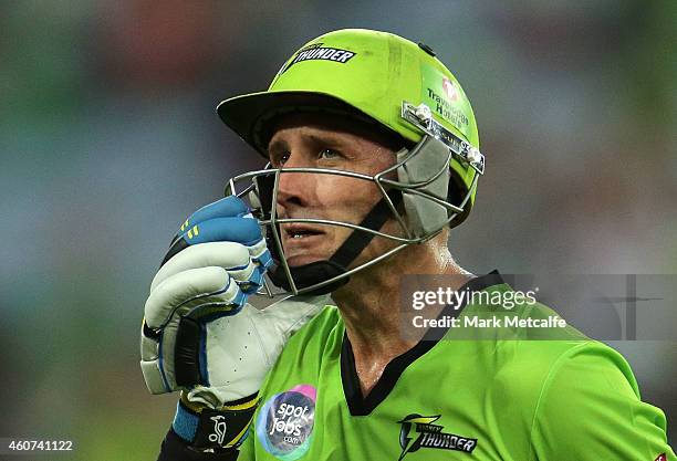 Mike Hussey of the Thunder acknowledges the crowd after being dismissed after scoring a half century during the Big Bash League match between the...