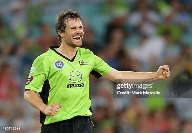 Dirk Nannes of the Thunder celebrates taking the wicket of Daniel Vettori of the Heat during the Big Bash League match between the Sydney Thunder and...