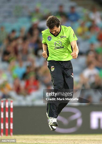 Dirk Nannes of the Thunder celebrates taking the wicket of Daniel Vettori of the Heat during the Big Bash League match between the Sydney Thunder and...