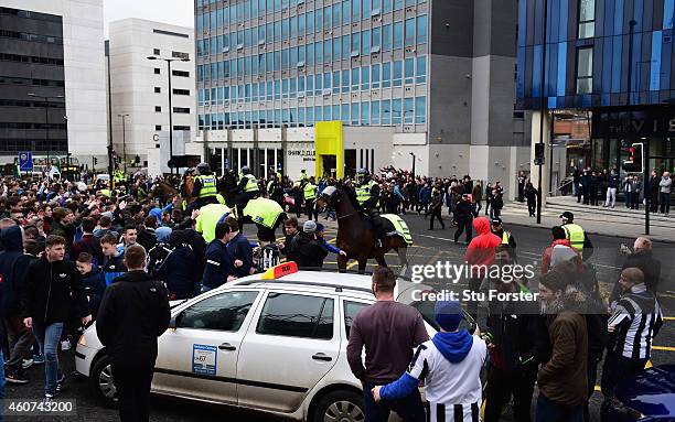 The Police horses disperse the Newcastle fans as the Sunderland fans arrive before the Barclays Premier League match between Newcastle United and...