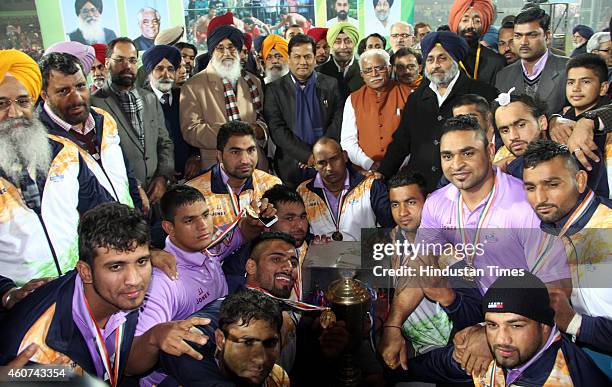 Indian men Kabaddi Team With trophy after winning with Punjab Chief Minister Parkash Singh Badal and Deputy Chief Minister Sukhbir Badal and Haryana...