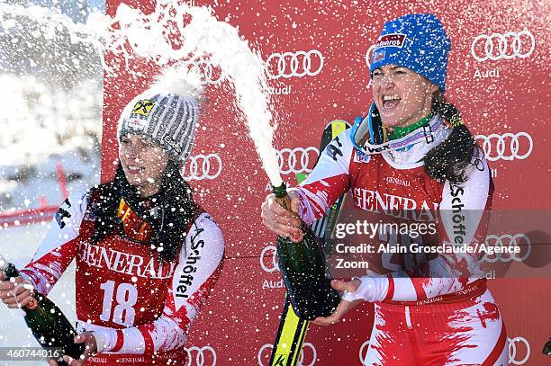 Anna Fenninger and Elisabeth Goerg celebrate on the podium during the Audi FIS Alpine Ski World Cup Women's Super-G on December 21, 2014 in Val...