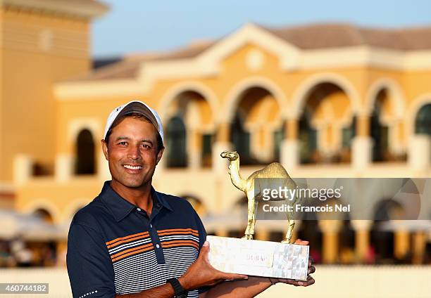Arjun Atwal of India with the winners trophy after the final round of the Dubai Open at The Els Club Dubai on December 21, 2014 in Dubai, United Arab...
