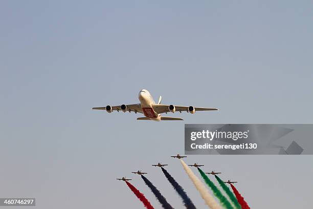 emirates a380 and uae aerobatic display team - uae airshow stock pictures, royalty-free photos & images