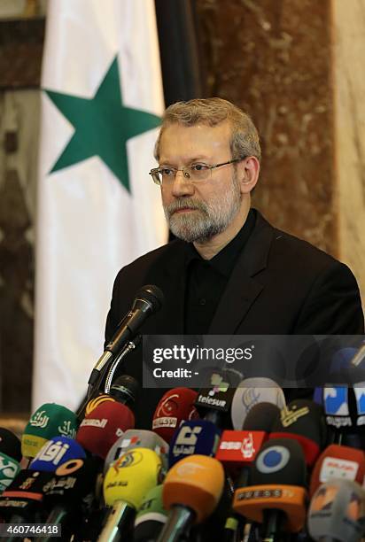 Speaker of Iran's parliament Ali Larijani holds a press conference with his Syrian counterpart Mohammad al-Lahham on December 21 during an official...