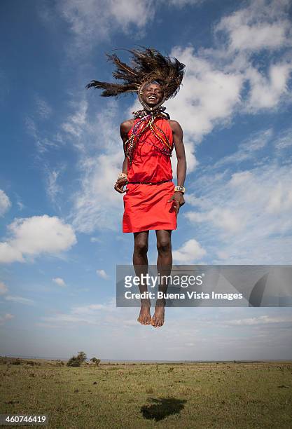 masai warrior jumping in air - masai stockfoto's en -beelden