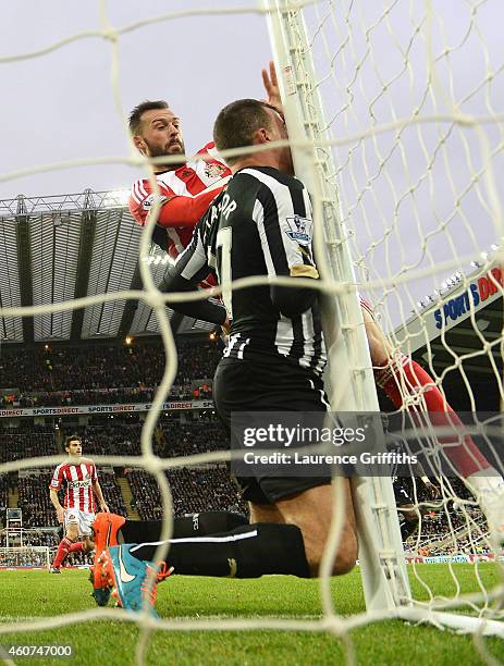 Steven Taylor of Newcastle United collides with the post during the Barclays Premier League match between Newcastle United and Sunderland at St...