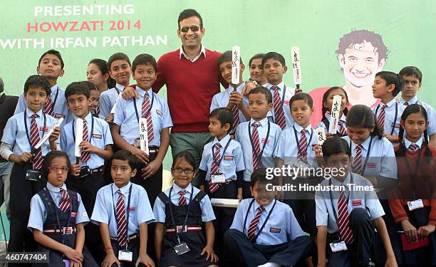Indian cricketer Irfan Pathan with students during celebration of sports carnival at Asnani School on December 21, 2014 in Bhopal, India.