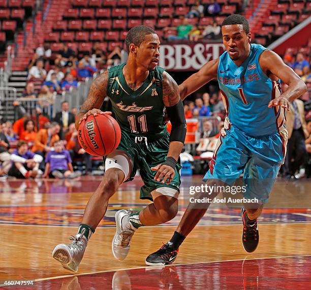 Devon Bookert of the Florida State Seminoles defends against Anthony Collins of the South Florida Bulls during the MetroPCS Orange Bowl Basketball...
