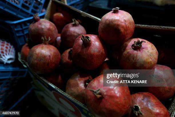 Pomegranates are displayed at a shop in downtown Tehran on December 21 in preparation for the annual festival of Yalda, an ancient Zoroastrian rite...