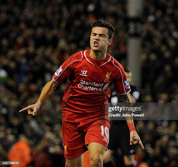 Philippe Coutinho of Liverpool celebrates his goal to make it 1-0 during the Barclays Premier League match between Liverpool and Arsenal at Anfield...