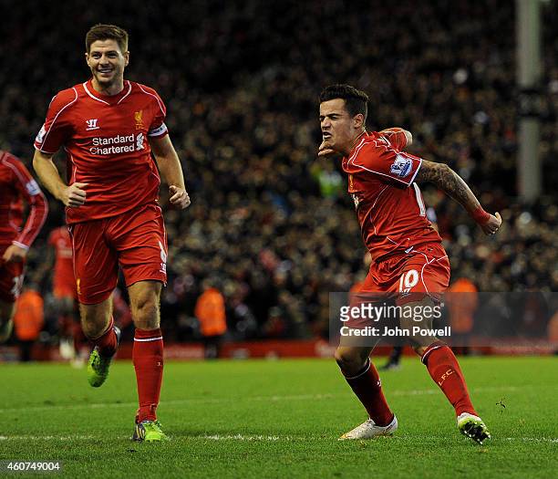 Philippe Coutinho of Liverpool celebrates his goal with Steven Gerrard during the Barclays Premier League match between Liverpool and Arsenal at...