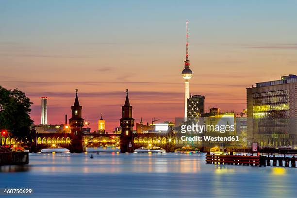 germany, berlin, view of oberbaum bridge at spree river - oberbaumbruecke stock pictures, royalty-free photos & images