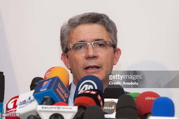Tunisia's presidential candidate Moncef Marzouki's campaign manager, Adnan Mancer holds a press conference after polling stations close down during...