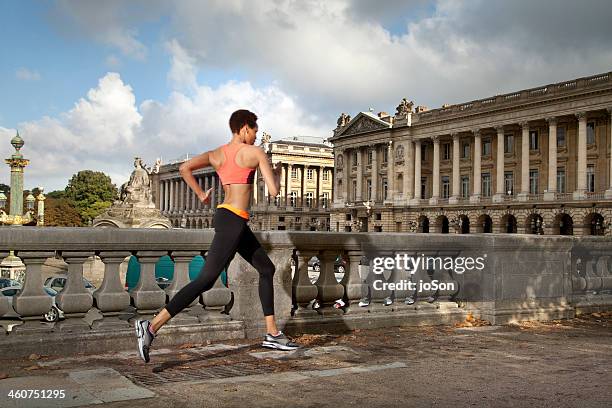 woman running in the garden, paris - running paris stock-fotos und bilder