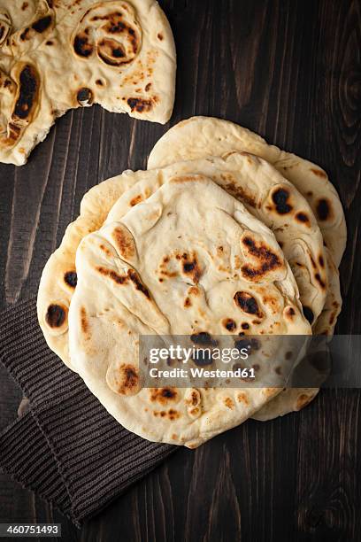 flat breads on wooden table, close up - pitta bread stock pictures, royalty-free photos & images
