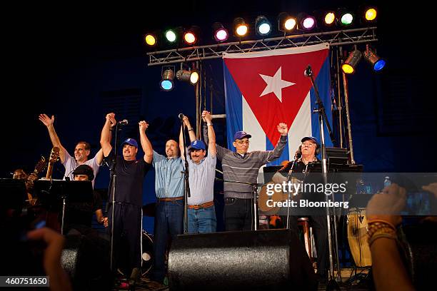 The Cuban Five, hands raised, make a public appearance together during a concert by Cuban musician Silvio Rodriguez in Havana, Cuba, on Saturday,...