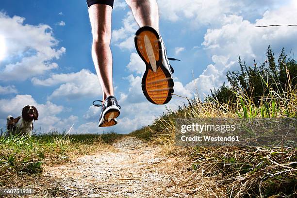 germany, bavaria, mature man jogging - schuhsohle stock-fotos und bilder