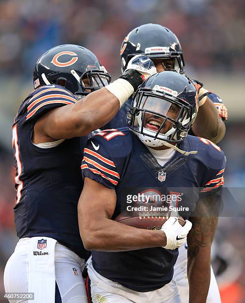 Ryan Mundy of the Chicago Bears celebrates his interception on the 2-yard line with Jon Bostic and Christian Jones during the second quarter of their...