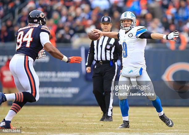 Matthew Stafford of the Detroit Lions passes the ball as Cornelius Washington of the Chicago Bears defends during the second quarter at Soldier Field...