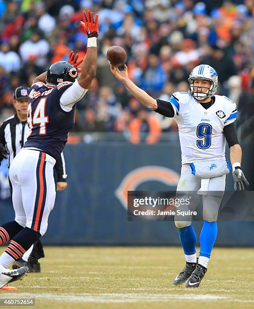 Matthew Stafford of the Detroit Lions passes the ball as Cornelius Washington of the Chicago Bears defends during the second quarter at Soldier Field...