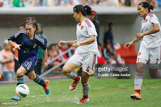Camila Gomez Ares of Argentina competes with Li Jiayue and Liu Shanshan of China in the Brasilia International Tournament match between Argentina and...
