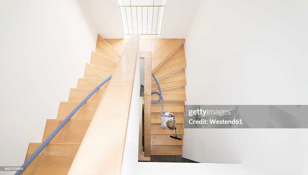Austria, Boy cleaning stairs