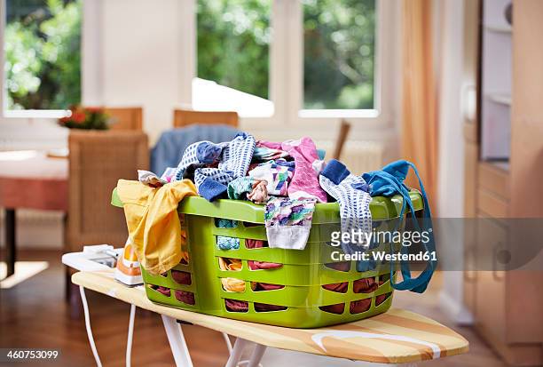 germany, north rhine westphalia, cologne, clothes in laundry basket - laundry basket foto e immagini stock