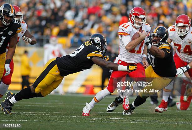 Alex Smith of the Kansas City Chiefs tries to break through the defense of Jason Worilds and Cameron Heyward of the Pittsburgh Steelers during the...