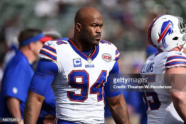 Mario Williams of the Buffalo Bills walks on the sidelines during pregame against the Oakland Raiders at O.co Coliseum on December 21, 2014 in...