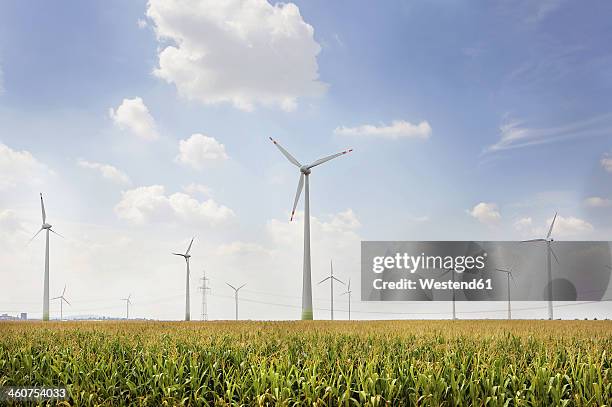 germany, view of wind turbine on field - windkraftanlage stock-fotos und bilder