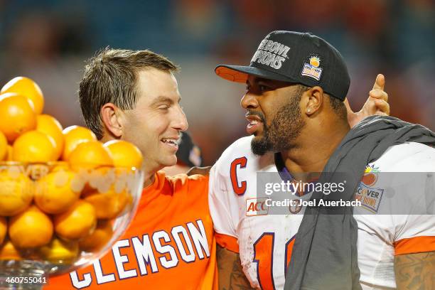 Head coach Dabo Swinney, and Tajh Boyd of the Clemson Tigers celebrate their victory against the Ohio State Buckeyes after the 2014 Discover Orange...